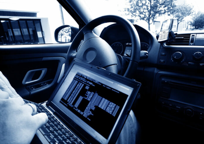 Man stealing data from a laptop